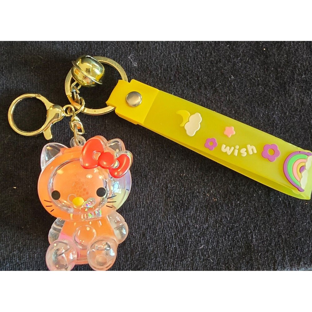 Hello Kitty Wish Keychain inside filled with liquid glittery circles and more